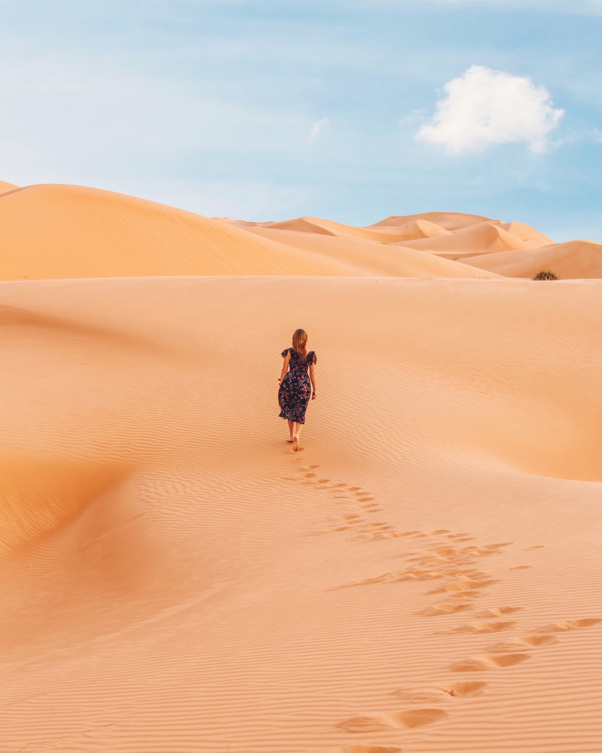 Desert with woman walking