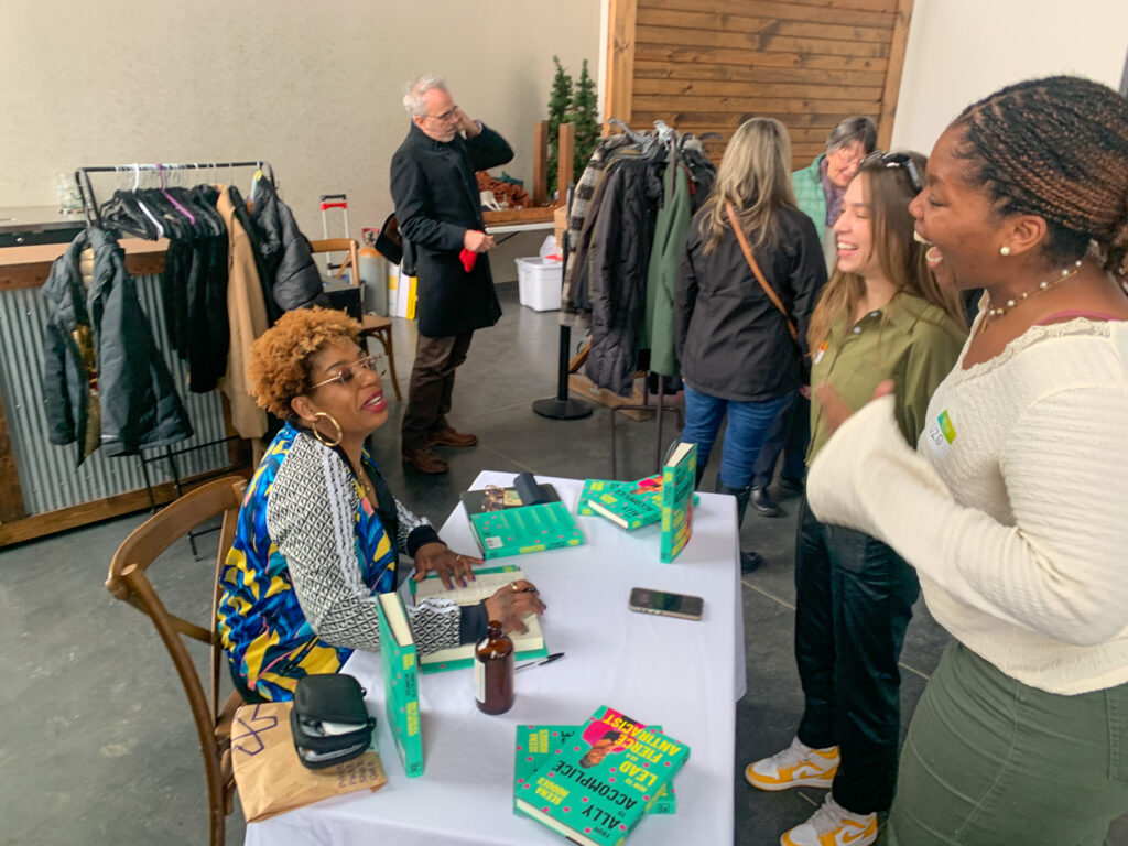 Seena Hodges signing books at Creative Mornings Minneapolis