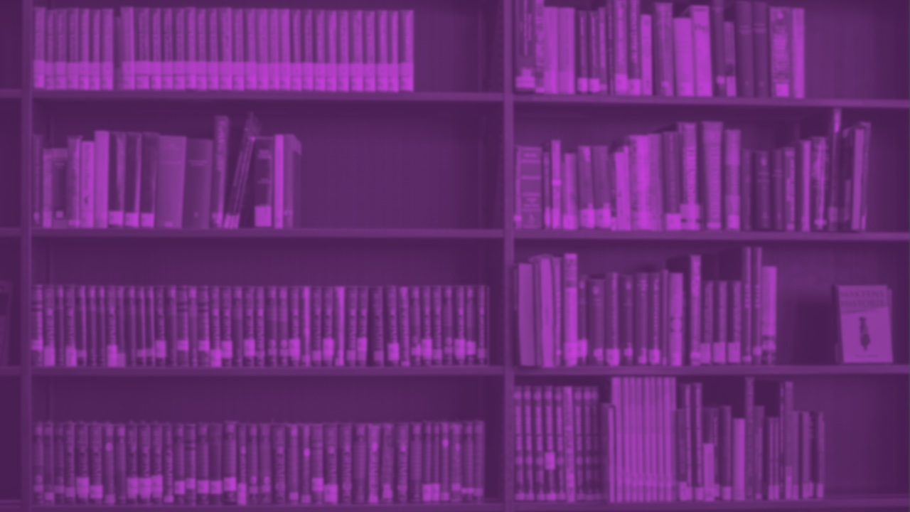 library shelves of books in dark purple