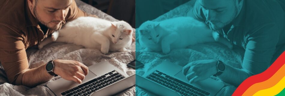 Gay man resting with his cat in bed