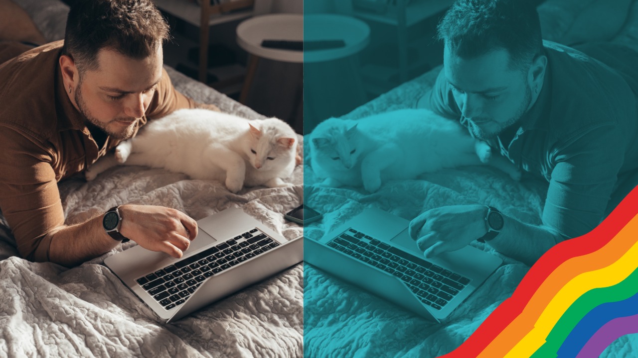 Gay man resting with his cat in bed